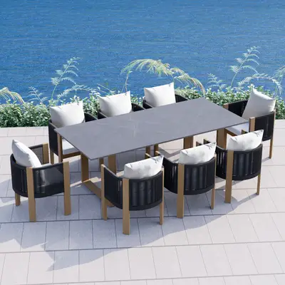 Preisvergleich für Gartentisch mit 8 Stühlen aus Stein und Polyrattan, wetterfeste rechteckige Essgruppe in Schwarz und Grau für Outdoor und